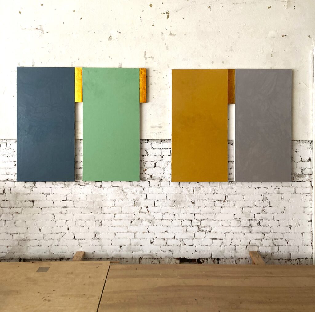 Image of Steve Joy's painting 'Seasons' installed on a white brick wall in Maple Street Construct exhibition space