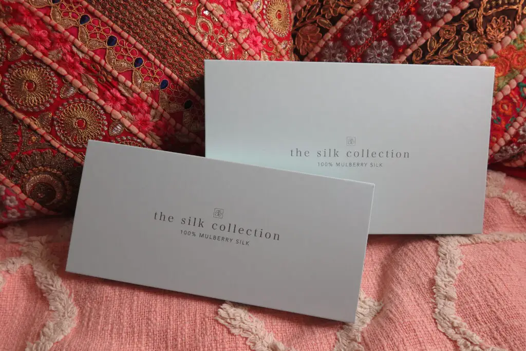 Image to show the two duck egg blue presentation boxes with The Silk Collection logo