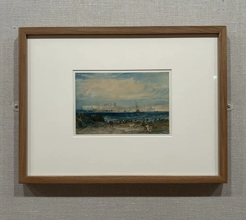 an image of a framed piece by JMW Turner, 'Margate' (For Picturesque Views on the Southern Coast of England), c.1822, watercolour, against a backdrop of grey Dutch linen.